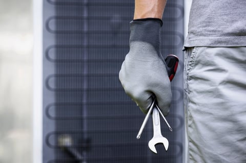 Refrigerator maintenance worker with tools